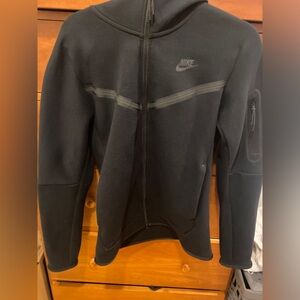 Black nike tech fleece. Super popular with younger generations or for workout.